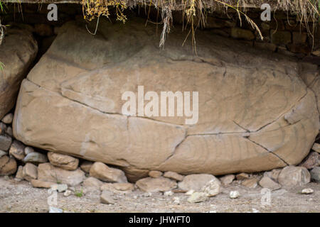 Neolithic art displayed on large stones, Kerbstones with spirals and lozenges at Knowth, Boyne Valley, Meath Ireland Stock Photo