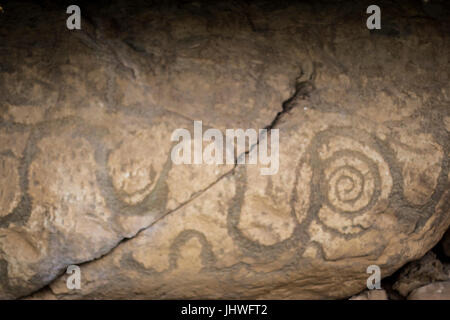 Neolithic art displayed on large stones, Kerbstones with spirals and lozenges at Knowth, Boyne Valley, Meath Ireland Stock Photo