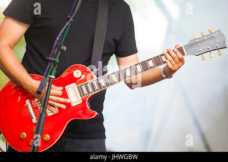 Guitarist in stage lights Stock Photo