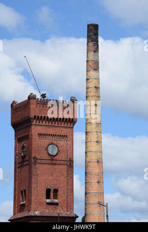 Old brick factory with chimney Stock Photo