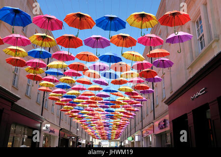 Umbrellas shading a street in Bath, England Stock Photo