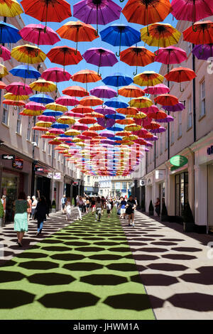 Umbrellas shading a street in Bath, England Stock Photo