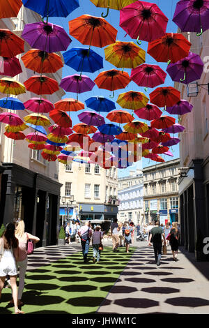 Umbrellas shading a street in Bath, England Stock Photo