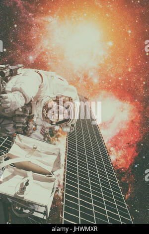 Astronaut on space mission. Elements of this image furnished by NASA. Stock Photo