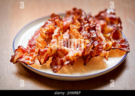 Streaky fried bacon rashers Stock Photo