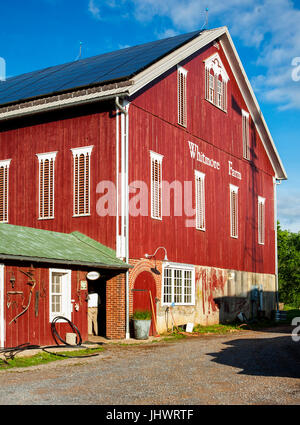 Red barn, farm, blue sky Stock Photo
