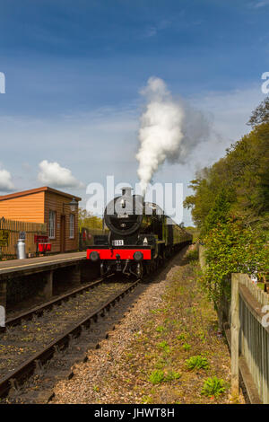Ex-LMS and S&D loco 53808 arrives at Stogumber station with a train to Bishops Lydeard on the West Somerset Railway, UK