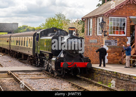 Ex-BR tank engine 1501 arrives at Williton station with a train to Minehead on the West Somerset Railway, UK Ex-BR tank engine 1501 arrives at Williton station with a train to Minehead on the West Somerset Railway, UK