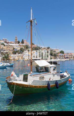 Symi Island, South Aegean, Greece - a fishing boat in the harbour at the main town / port, Gialos (or Yialos, as it is also known) Stock Photo