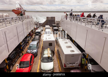 Passengers and vehicles aboard the Pentland ferry from Gills Bay in Caithness to St Margaret's Hope, South Ronaldsay in Orkney UK Stock Photo