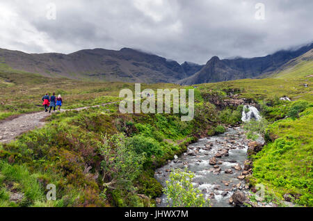 Walkers on the path to the Fairy Pools, Glen Brittle, Isle of Skye, Highland, Scotland, UK Stock Photo