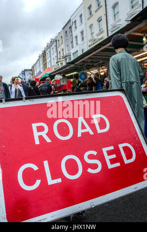 Portobello Road is closed to traffic due to it being market day. Stock Photo