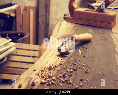 Wood worker tools on an old  workbench in a carpentry Stock Photo