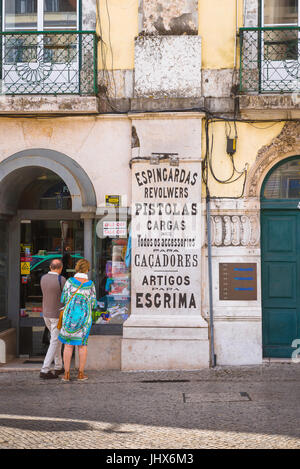 Lisbon Baixa, view of a middle aged couple looking in a shop window in the Baixa district of Lisbon, Portugal. Stock Photo