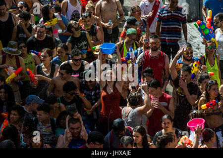 Madrid, Spain, 16th July, 2017. Revelers take part in the annual water fight (Naval Battle of Vallecas) where thousands of people gather each year to fight with water in the streets of Vallecas neighborhood of Madrid, Spain. Credit: Marcos del Mazo/Alamy Live News Stock Photo