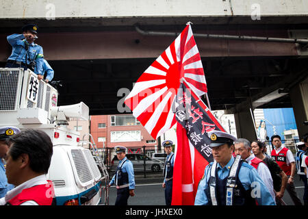 TOKYO, JAPAN - JULY 16: Japanese nationalists holding Japanese flags took to the streets in a 'hate demonstration' in Akihabara, Tokyo, Japan on July 16, 2017. The nationalists faced off with anti-racist groups who mounted counter protests demanding an end to hate speech and racism in Japan. Credit: Richard Atrero de Guzman/AFLO/Alamy Live News Stock Photo