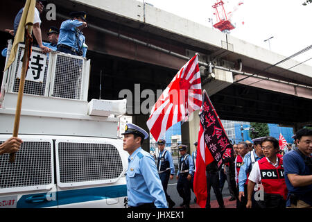 TOKYO, JAPAN - JULY 16: Japanese nationalists holding Japanese flags took to the streets in a 'hate demonstration' in Akihabara, Tokyo, Japan on July 16, 2017. The nationalists faced off with anti-racist groups who mounted counter protests demanding an end to hate speech and racism in Japan. Credit: Richard Atrero de Guzman/AFLO/Alamy Live News Stock Photo