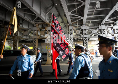 TOKYO, JAPAN - JULY 16: Japanese nationalists holding flags took to the streets in a 'hate demonstration' in Akihabara, Tokyo, Japan on July 16, 2017. The nationalists faced off with anti-racist groups who mounted counter protests demanding an end to hate speech and racism in Japan. Credit: Richard Atrero de Guzman/AFLO/Alamy Live News Stock Photo