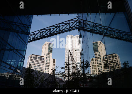 Berlin, Germany. 17th July, 2017. The skyscraper Upper West at Breitscheidplatz square and the Hotel Waldorf Astoria in the district of Charlottenburg, photographed through a glass facade in Berlin, Germany, 17 July 2017. Photo: Jens Kalaene/dpa-Zentralbild/ZB/dpa/Alamy Live News Stock Photo