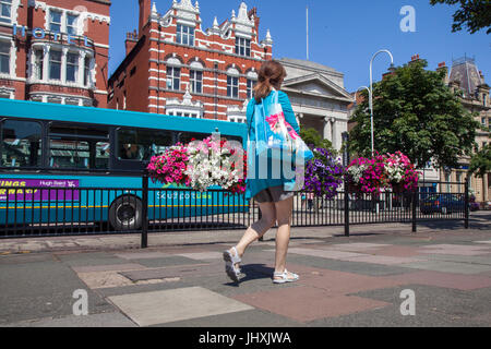 Southport, Merseyside, UK. 17th Jul, 2017. Busy Town Centre, with tourists and shoppers enjoying the sunshine and hot weather, on Open Golf Week. The Championship is based at Royal Birkdale and up to 40,000 spectators are expected in the resort to sample the shopping in Lord Street and the Golf Based attractions in the Princess Diana Gardens in front of The Atkinson in Southport town centre. Credit: MediaWorldImages/Alamy Live News Stock Photo