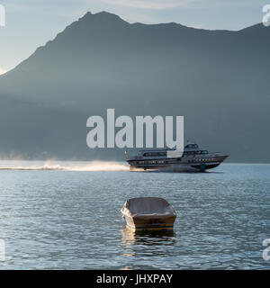 Hydrofoil boat approaches Bellagio Lake Como Italy Stock Photo