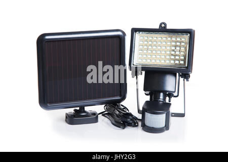 Small solar cell panel and LED light with movement sensor on white background. Stock Photo