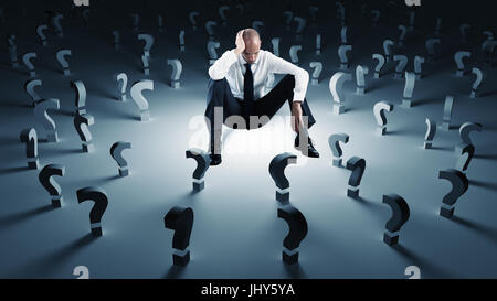 Businessman with many question marks. Concept of failure and problem Stock Photo