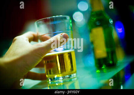Hand with glass of beer, Hand mit Glas Bier Stock Photo