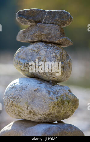 Stacked river stones in the running through, Austria, Lower Austria, nature reserve ?tscher Torm?uer - Stacked stones At Running through river, Austri Stock Photo