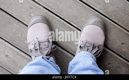Sneaker shoes on wooden floor. Close up. Life style conception. Stock Photo
