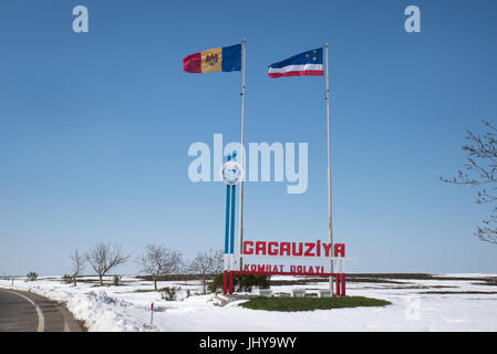 Moldovan and Gagauz flags fly at the 'Welcome to Gagauzia' sign at border of the autonomous region of Gagauzia Stock Photo