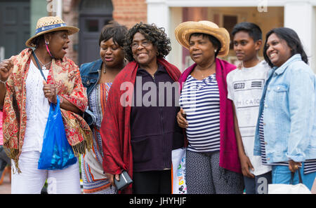 Black female tourists having a group photo taken. Stock Photo