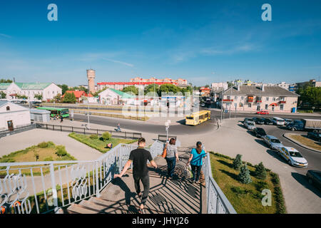 Brest, Belarus - June 6, 2017: People Rush On Pedestrian Crossing Bridge To Bus Stop Near Brest Central, Brest-Tsentralny Railway Station In Sunny Sum Stock Photo