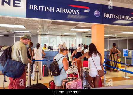 Customers check in for a flight in the Caribbean Stock Photo