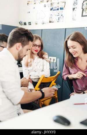 Young people meeting communicate architect designers 20s. Stock Photo