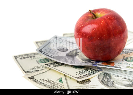 Dollars with red apple isolated on white Stock Photo