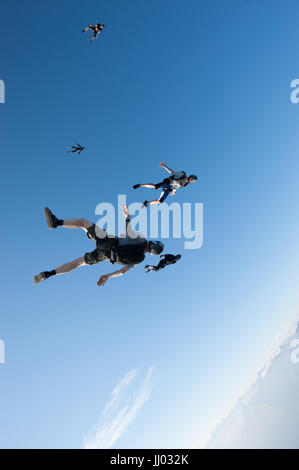 A skydiver tracking over Locarno, Witzerland with the Alps in the background Stock Photo