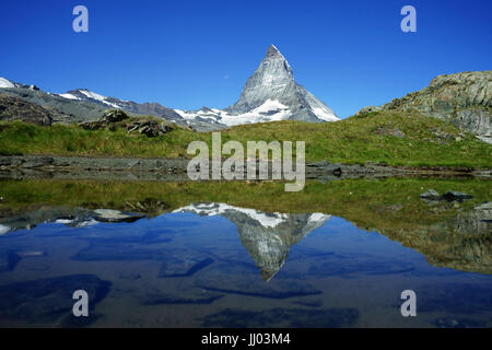 penninianMattrerhorn above Zermatt regfelcting in small pond at Gagenhaupt, Swiss alps, Switzerland Stock Photo