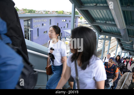 Shoppers arriving at Bicester Village rail station Stock Photo