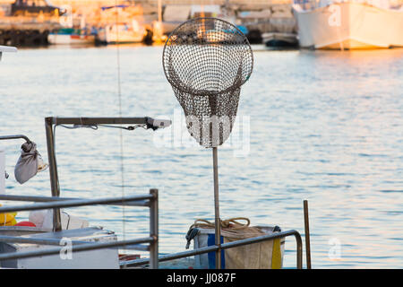 Fishing At Sunrise On Saltwater With A Boat And Dip Net Photo