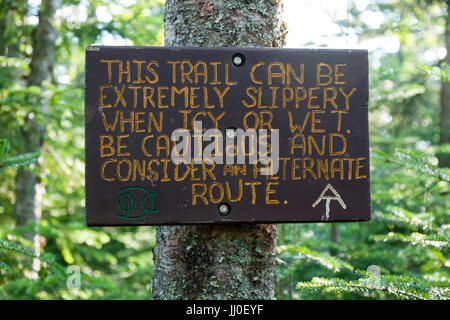 Warning sign along the Appalachian Trail (Beaver Brook Trail) in Kinsman Notch of the New Hampshire White Mountains during the summer months. Stock Photo