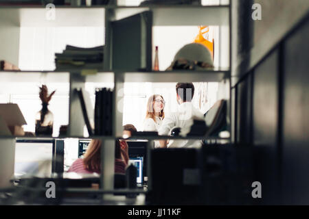 Two architects discussing new project at modern office. Stock Photo