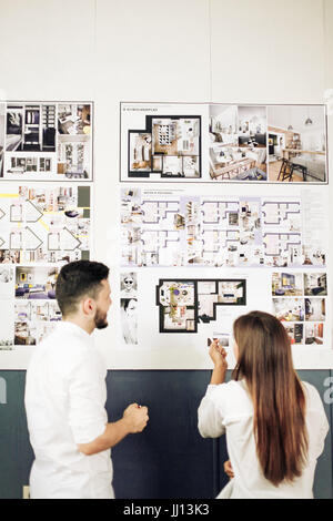Two architects discussing new project at modern office. Stock Photo
