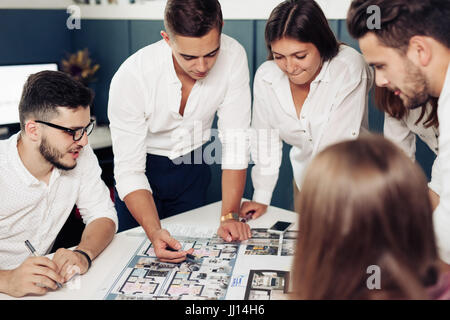 Team of architects working on construction plans. Stock Photo