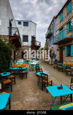 Main street with coffee shops in Chora of Alonissos island, Greece. Stock Photo
