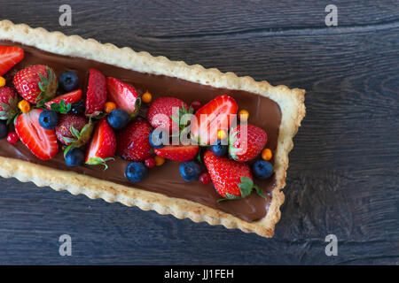 Tart with strawberries, blueberries and chocolate Stock Photo