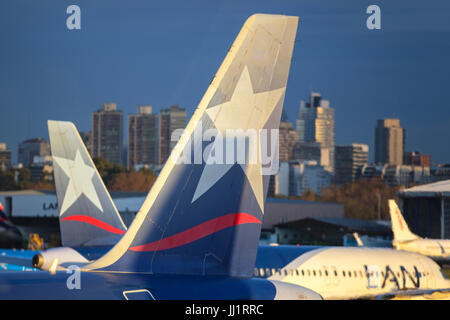 Latam airplanes with the skyascrapers of the city in the background. Aeroparque, Buenos Aires, Argentina. Stock Photo