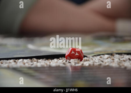 A red rolled dice while playing a star wars role playing game (RPG). Stock Photo