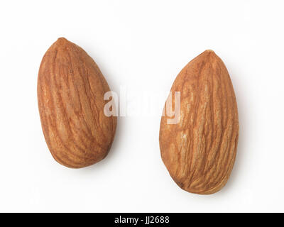 Closeup of two shelled almonds, almond nuts, isolated on white background Stock Photo