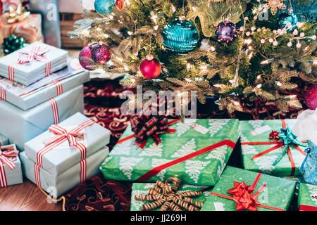 Family Christmas gifts in a living room waiting to be opened Stock Photo
